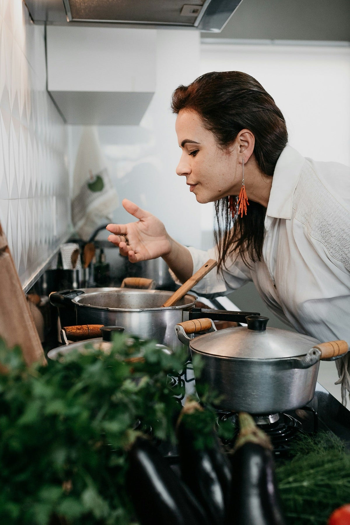 Home cook checking pots on the stove